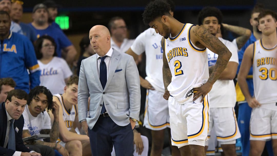 Jan 31, 2026; Los Angeles, California, USA; UCLA Bruins head coach Mick Cronin and guard Donovan Dent (2) react on the bench as the lost to the Indiana Hoosiers in double overtime at Pauley Pavilion presented by Wescom Financial. Mandatory Credit: Jayne Kamin-Oncea-Imagn Images