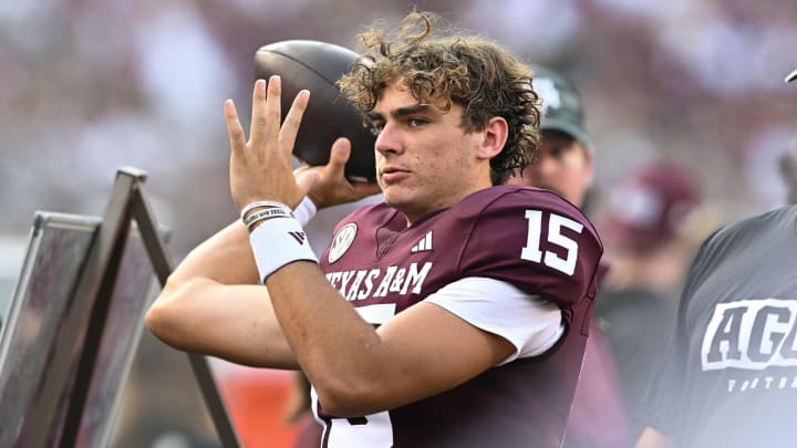 Sep 2, 2023; College Station, Texas, USA; Texas A&M Aggies quarterback Conner Weigman (15) warms up on the sideline during the first quarter against the New Mexico Lobos at Kyle Field. 