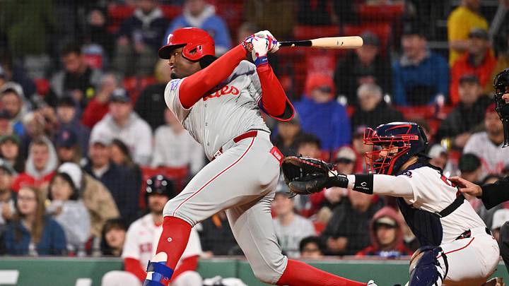 May 14, 2026; Boston, Massachusetts, USA; Philadelphia Phillies left fielder Felix Reyes (29) hits a single against the Boston Red Sox during the fifth inning at Fenway Park. Mandatory Credit: Eric Canha-Imagn Images