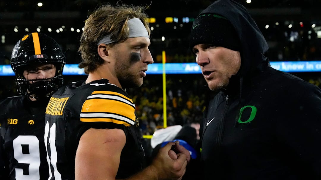 Iowa Hawkeyes quarterback Mark Gronowski (11) shakes hands Nov. 8, 2025 after a Big Ten Football game against the Oregon Ducks at Kinnick Stadium in Iowa City, Iowa.