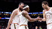 Apr 5, 2024; New Orleans, Louisiana, USA; San Antonio Spurs guard Devonte' Graham (4) slaps hands with forward Zach Collins (23) against the New Orleans Pelicans during the second half at Smoothie King Center. Mandatory Credit: Stephen Lew-Imagn Images