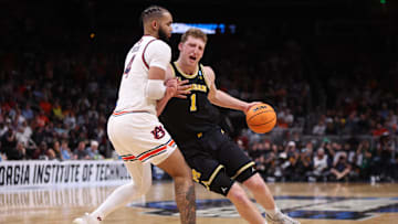 Mar 28, 2025; Atlanta, GA, USA; Michigan Wolverines center Danny Wolf (1) drives against Auburn Tigers forward Johni Broome (4) in the second half of a South Regional semifinal of the 2025 NCAA tournament at State Farm Arena. Mandatory Credit: Brett Davis-Imagn Images