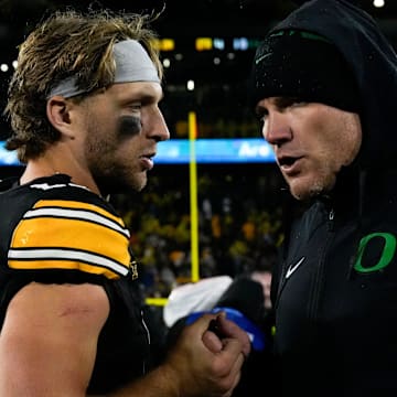 Iowa Hawkeyes quarterback Mark Gronowski (11) shakes hands Nov. 8, 2025 after a Big Ten Football game against the Oregon Ducks at Kinnick Stadium in Iowa City, Iowa.