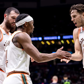 Apr 5, 2024; New Orleans, Louisiana, USA; San Antonio Spurs guard Devonte' Graham (4) slaps hands with forward Zach Collins (23) against the New Orleans Pelicans during the second half at Smoothie King Center. Mandatory Credit: Stephen Lew-Imagn Images
