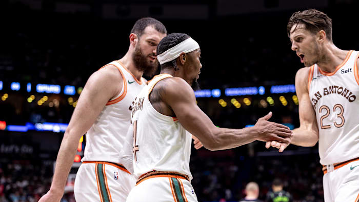 Apr 5, 2024; New Orleans, Louisiana, USA; San Antonio Spurs guard Devonte' Graham (4) slaps hands