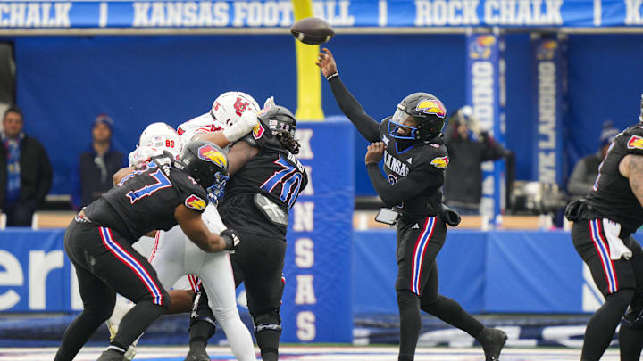 Nov 28, 2025; Lawrence, Kansas, USA; Kansas Jayhawks quarterback Jalon Daniels (6) throws a pass during the first half against the Utah Utes at David Booth Kansas Memorial Stadium. Mandatory Credit: Jay Biggerstaff-Imagn Images