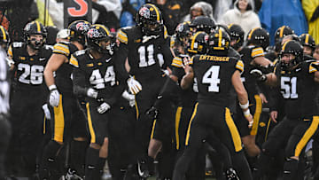 Nov 8, 2025; Iowa City, Iowa, USA; The Iowa Hawkeyes react after an interception by defensive back Deshaun Lee (obscured) during the first quarter against the Oregon Ducks at Kinnick Stadium. Mandatory Credit: Jeffrey Becker-Imagn Images
