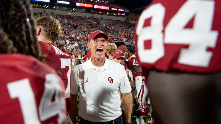 Oklahoma head coach Brent Venables talks with players after an NCAA football game between Oklahoma (OU) and Temple at the Gaylord Family Oklahoma Memorial Stadium in Norman, Okla., on Friday, Aug. 30, 2024.