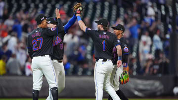 Jun 14, 2024; New York City, New York, USA; New York Mets third baseman Mark Vientos (27) and second baseman Jeff McNeil (1) and shortstop Francisco Lindor (12) and first baseman Pete Alonso (20) celebrate the victory together after the ninth inning against the San Diego Padres at Citi Field. Mandatory Credit: Gregory Fisher-USA TODAY Sports