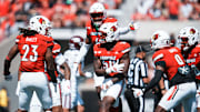 Louisville Cardinals defensive lineman Clev Lubin (50) and the defense celebrate a stop against visiting Eastern Kentucky University at the Cardinals' football season opener Saturday, August 30, 2025 at L&N Federal Credit Union Stadium in Louisville, Kentucky.