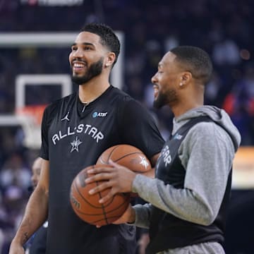 Feb 15, 2025; Oakland, CA, USA; Shaq’s OGs forward Jayson Tatum (0) of the Boston Celtics interacts with guard Damian Lillard (0) of the Milwaukee Bucks during the NBA All Star-Practice at Oracle Arena. Mandatory Credit: Cary Edmondson-Imagn Images