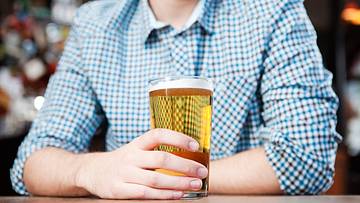 A person drinking beer