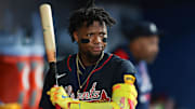 Aug 27, 2025; Miami, Florida, USA; Atlanta Braves designated hitter Ronald Acuna (13) swings his bat inside the dugout against the Miami Marlins during the fourth inning at loanDepot Park. Mandatory Credit: Sam Navarro-Imagn Images