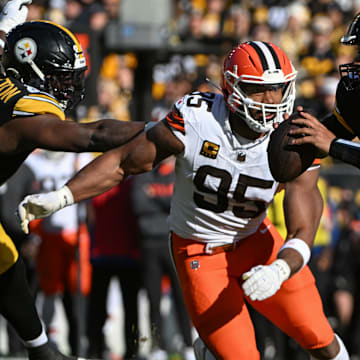 Dec 8, 2024; Pittsburgh, Pennsylvania, USA; Pittsburgh Steelers quarterback Russell Wilson (3) is chased by Cleveland Browns defensive end Myles Garrett (95) during the first quarter at Acrisure Stadium. Mandatory Credit: Barry Reeger-Imagn Images