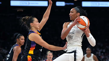 Jun 29, 2025; Phoenix, Arizona, USA; Las Vegas Aces center A'ja Wilson (22) looks to shoot over Phoenix Mercury forward Kathryn Westbeld (24)  in the first half at Footprint Center. Mandatory Credit: Rick Scuteri-Imagn Images