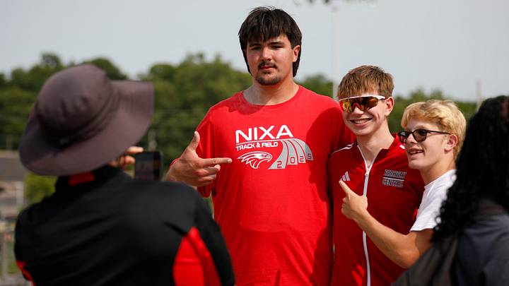 Fans lines up to have their photo taken with Nixa junior Jackson Cantwell after he competed in the shot put championship on May 31, 2025, in Jefferson City. Cantwell, the No. 1 football recruit in the 2026 class, committed to Miami (Florida) earlier in the month.