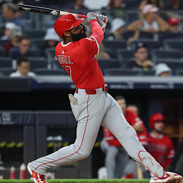 Jun 18, 2025; Bronx, New York, USA; Los Angeles Angels center fielder Jo Adell (7) hits a solo home run during the sixth inning against the New York Yankees at Yankee Stadium. Mandatory Credit: Vincent Carchietta-Imagn Images