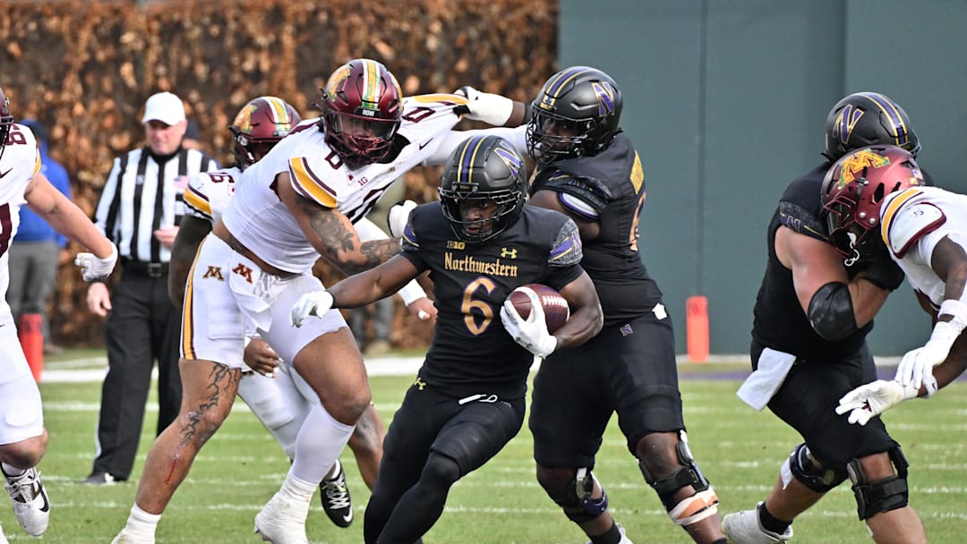 Nov 22, 2025; Chicago, Illinois, USA; Northwestern Wildcats running back Joseph Himon II (6) runs the ball against the Minnesota Golden Gophers during the first half at Wrigley Field. Mandatory Credit: Patrick Gorski-Imagn Images