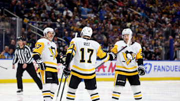 Jan 17, 2025; Buffalo, New York, USA;  Pittsburgh Penguins right wing Bryan Rust (17) celebrates his goal with teammates during the third period against the Buffalo Sabres at KeyBank Center. Mandatory Credit: Timothy T. Ludwig-Imagn Images