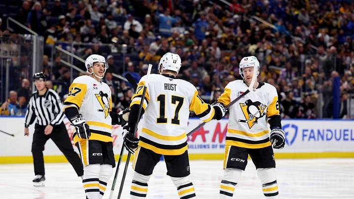Jan 17, 2025; Buffalo, New York, USA;  Pittsburgh Penguins right wing Bryan Rust (17) celebrates his goal with teammates during the third period against the Buffalo Sabres at KeyBank Center. Mandatory Credit: Timothy T. Ludwig-Imagn Images