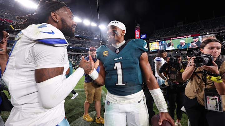 Philadelphia Eagles quarterback Jalen Hurts shakes hands with Dallas Cowboys cornerback Trevon Diggs.
