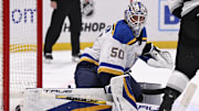Mar 5, 2025; Los Angeles, California, USA;  St. Louis Blues goaltender Jordan Binnington (50) deflects a shot by the Los Angeles Kings during the second period at Crypto.com Arena. Mandatory Credit: Alex Gallardo-Imagn Images