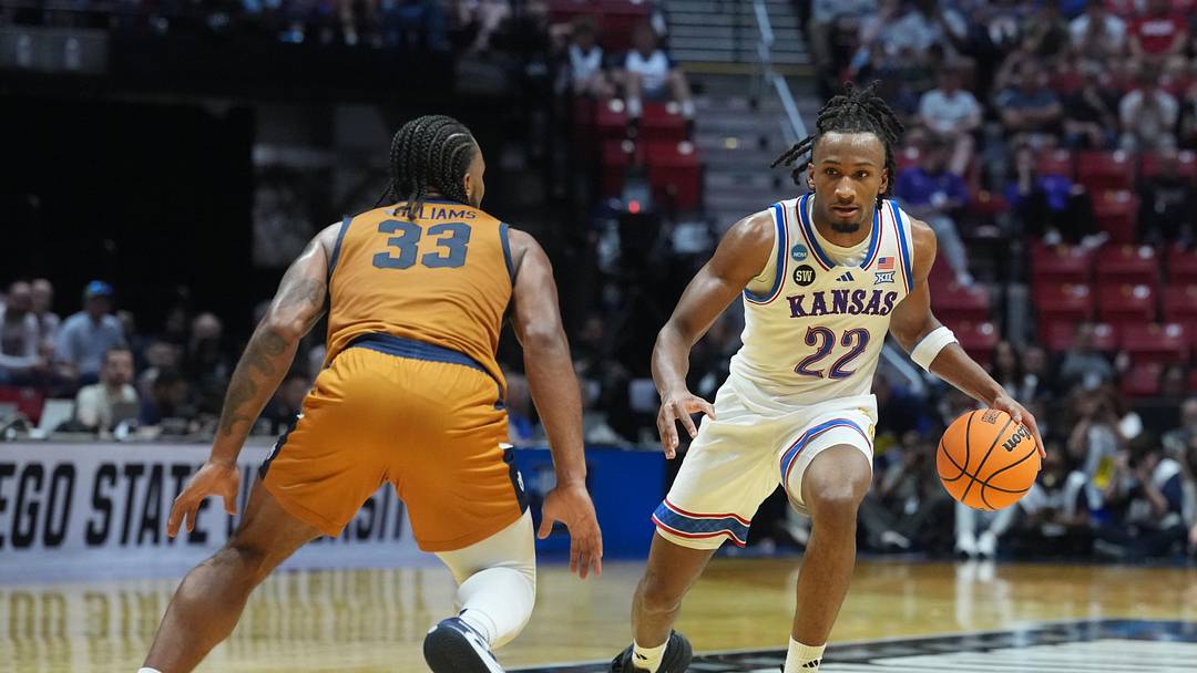 Mar 20, 2026; San Diego, CA, USA; Kansas Jayhawks guard Darryn Peterson (22) controls the ball against California Baptist Lancers guard Martel Williams (33) in the first half during a first round game of the men's 2026 NCAA Tournament at Viejas Arena. Mandatory Credit: Kirby Lee-Imagn Images