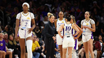 Sep 9, 2025; Phoenix, Arizona, USA; Los Angeles Sparks head coach Lynne Roberts talks with forward Azura Stevens (23), guard Kelsey Plum (10) and forward Dearica Hamby (5) as forward Rickea Jackson (2) walks away against the Phoenix Mercury during a WNBA game at PHX Arena. Mandatory Credit: Mark J. Rebilas-Imagn Images