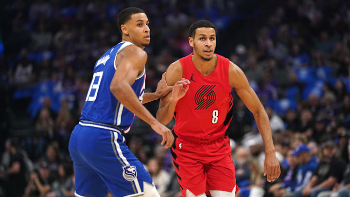 Apr 14, 2024; Sacramento, California, USA; Sacramento Kings forward Keegan Murray (13) defends Portland Trail Blazers forward Kris Murray (8) in the first quarter at the Golden 1 Center. Mandatory Credit: Cary Edmondson-Imagn Images