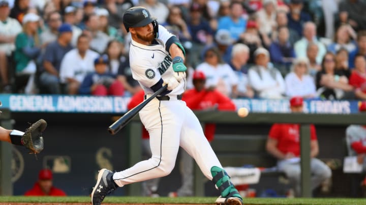 Seattle Mariners first baseman Tyler Locklear hits a single against the Los Angeles Angels on Tuesday at T-Mobile Park.