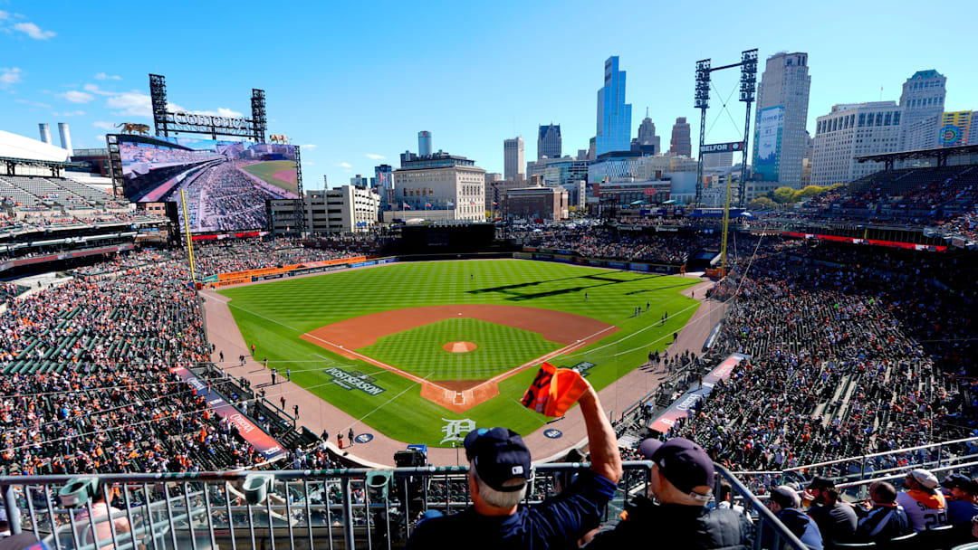 A Detroit Tigers fan waves his orange towel before the start of Game 4 between the Seattle Mariners and the Detroit Tigers in the ALDS at Comerica Park in Detroit on Wednesday, Oct. 8, 2025.