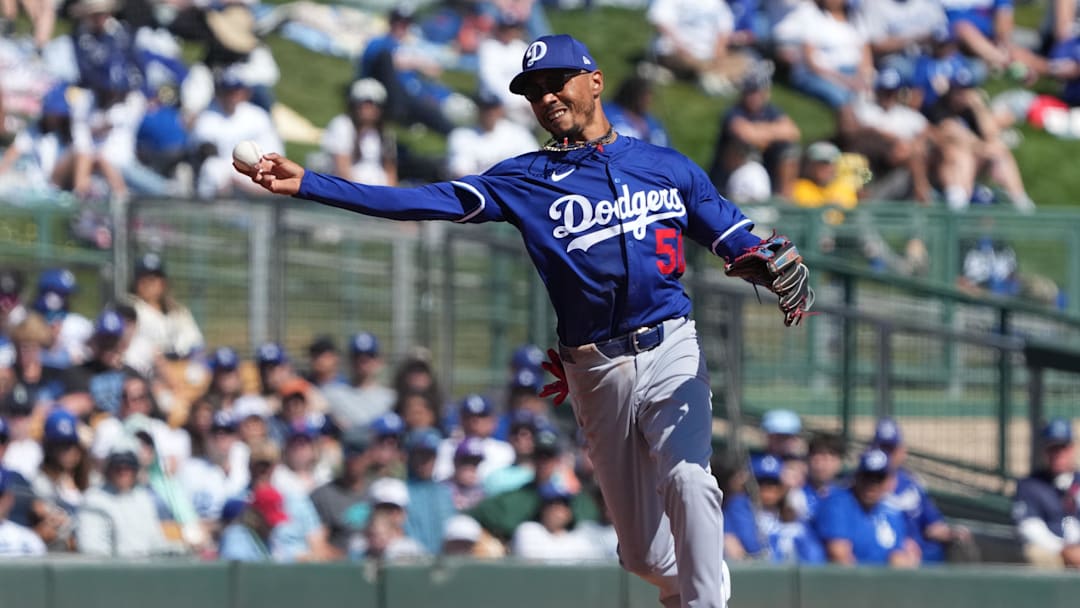 Mar 8, 2025; Phoenix, Arizona, USA; Los Angeles Dodgers shortstop Mookie Betts (50) makes the play for an out against the Chicago White Sox in the second inning at Camelback Ranch-Glendale. Mandatory Credit: Rick Scuteri-Imagn Images
