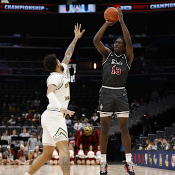 Mar 15, 2025; Washington, D.C., USA; Saint Joseph's Hawks forward Rasheer Fleming (13) shoots the ball over Saint Joseph's Hawks forward Shawn Simmons II (10) in the first half at Capital One Arena. Mandatory Credit: Geoff Burke-Imagn Images