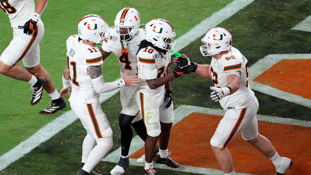 Jan 19, 2026; Miami Gardens, FL, USA; Miami Hurricanes wide receiver Malachi Toney (10) celebrates with offensive lineman James Brockermeyer (52) after scoring a touchdown against the Indiana Hoosiers during the second half of the College Football Playoff National Championship game at Hard Rock Stadium. Mandatory Credit: James Lang-Imagn Images Jan 19, 2026; Miami Gardens, FL, USA; Miami Hurricanes wide receiver Malachi Toney (10) celebrates with offensive lineman James Brockermeyer (52) after scoring a touchdown against the Indiana Hoosiers during the second half of the College Football Playoff National Championship game at Hard Rock Stadium. Mandatory Credit: James Lang-Imagn Images