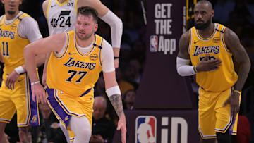 Feb 10, 2025; Los Angeles, California, USA; Los Angeles Lakers guard Luka Doncic (77) takes the ball down court as forward LeBron James (23) looks on against the Utah Jazz at Crypto.com Arena. Mandatory Credit: Jayne Kamin-Oncea-Imagn Images