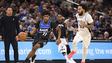 Dec 3, 2025; Orlando, Florida, USA; Orlando Magic guard Jase Richardson (11) drives to the hoop past San Antonio Spurs forward Julian Champagnie (30) in the fourth quarter at Kia Center. Mandatory Credit: Nathan Ray Seebeck-Imagn Images