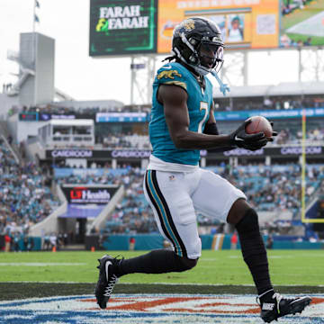 Dec 15, 2024; Jacksonville, Florida, USA; Jacksonville Jaguars wide receiver Brian Thomas Jr. (7) scores a touchdown against the New York Jets in the first quarter at EverBank Stadium. Mandatory Credit: Nathan Ray Seebeck-Imagn Images