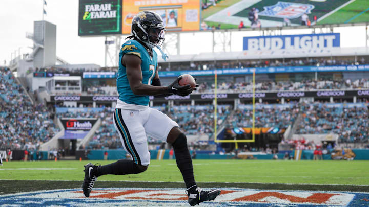 Dec 15, 2024; Jacksonville, Florida, USA; Jacksonville Jaguars wide receiver Brian Thomas Jr. (7) scores a touchdown against the New York Jets in the first quarter at EverBank Stadium. Mandatory Credit: Nathan Ray Seebeck-Imagn Images