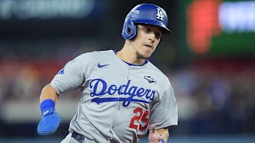 Oct 31, 2025; Toronto, Ontario, CAN; Los Angeles Dodgers second baseman Tommy Edman (25) runs home to score on a double by catcher Will Smith (16) in the third inning against the Toronto Blue Jays during game six of the 2025 MLB World Series at Rogers Centre. Mandatory Credit: John E. Sokolowski-Imagn Images