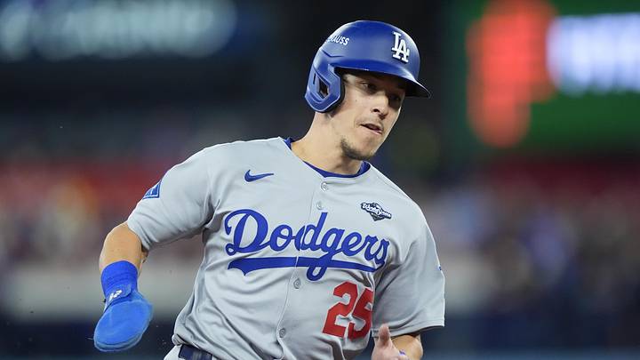 Oct 31, 2025; Toronto, Ontario, CAN; Los Angeles Dodgers second baseman Tommy Edman (25) runs home to score on a double by catcher Will Smith (16) in the third inning against the Toronto Blue Jays during game six of the 2025 MLB World Series at Rogers Centre. Mandatory Credit: John E. Sokolowski-Imagn Images