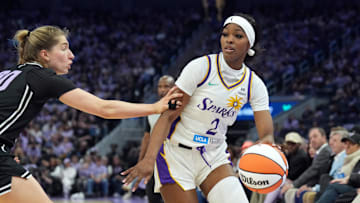 May 16, 2025; San Francisco, California, USA; Los Angeles Sparks forward Rickea Jackson (2) dribbles against Golden State Valkyries guard Kate Martin (left) during the second quarter at Chase Center. Mandatory Credit: Darren Yamashita-Imagn Images
