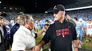 Nov 8, 2025; Chapel Hill, North Carolina, USA; North Carolina Tar Heels head coach Bill Belichick with Stanford Cardinal head coach Frank Reich after the game at Kenan Stadium. Mandatory Credit: Bob Donnan-Imagn Images