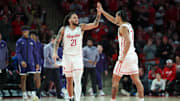 Houston guard Emanuel Sharp (left) gets congratulated by teammate Milos Uzan during a recent game.