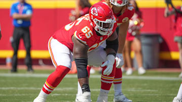 Aug 17, 2024; Kansas City, Missouri, USA; Kansas City Chiefs guard Trey Smith (65) on the line of scrimmage against the Detroit Lions during the game at GEHA Field at Arrowhead Stadium. Mandatory Credit: Denny Medley-Imagn Images