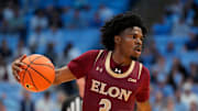 Nov 4, 2024; Chapel Hill, North Carolina, USA; Elon Phoenix guard TK Simpkins (3) dribbles in the first half at Dean E. Smith Center. Mandatory Credit: Bob Donnan-Imagn Images