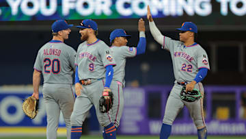 Apr 2, 2025; Miami, Florida, USA; New York Mets right fielder Juan Soto (22) celebrates with teammates after the game against the Miami Marlins at loanDepot Park. 