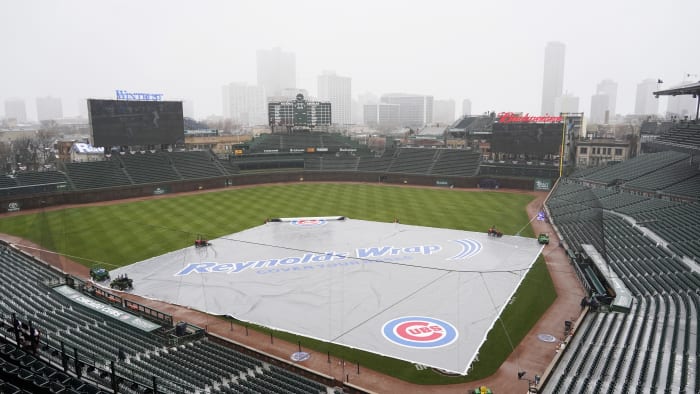 A tarp covers the Wrigley Field infield  