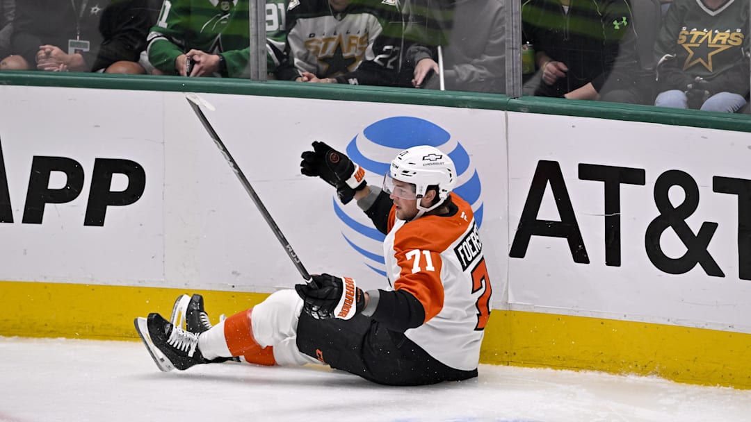 Mar 22, 2025; Dallas, Texas, USA; Philadelphia Flyers right wing Tyson Foerster (71) reacts to falling to the ice during the first period against the Dallas Stars at the American Airlines Center.