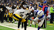 Sep 29, 2024; Indianapolis, Indiana, USA; Indianapolis Colts safety Nick Cross (20) knocks the ball out of hands of Pittsburgh Steelers wide receiver George Pickens (14) for a fumble during the second quarter at Lucas Oil Stadium. Mandatory Credit: Marc Lebryk-Imagn Images