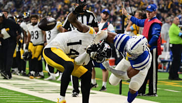Sep 29, 2024; Indianapolis, Indiana, USA; Indianapolis Colts safety Nick Cross (20) knocks the ball out of hands of Pittsburgh Steelers wide receiver George Pickens (14) for a fumble during the second quarter at Lucas Oil Stadium. Mandatory Credit: Marc Lebryk-Imagn Images